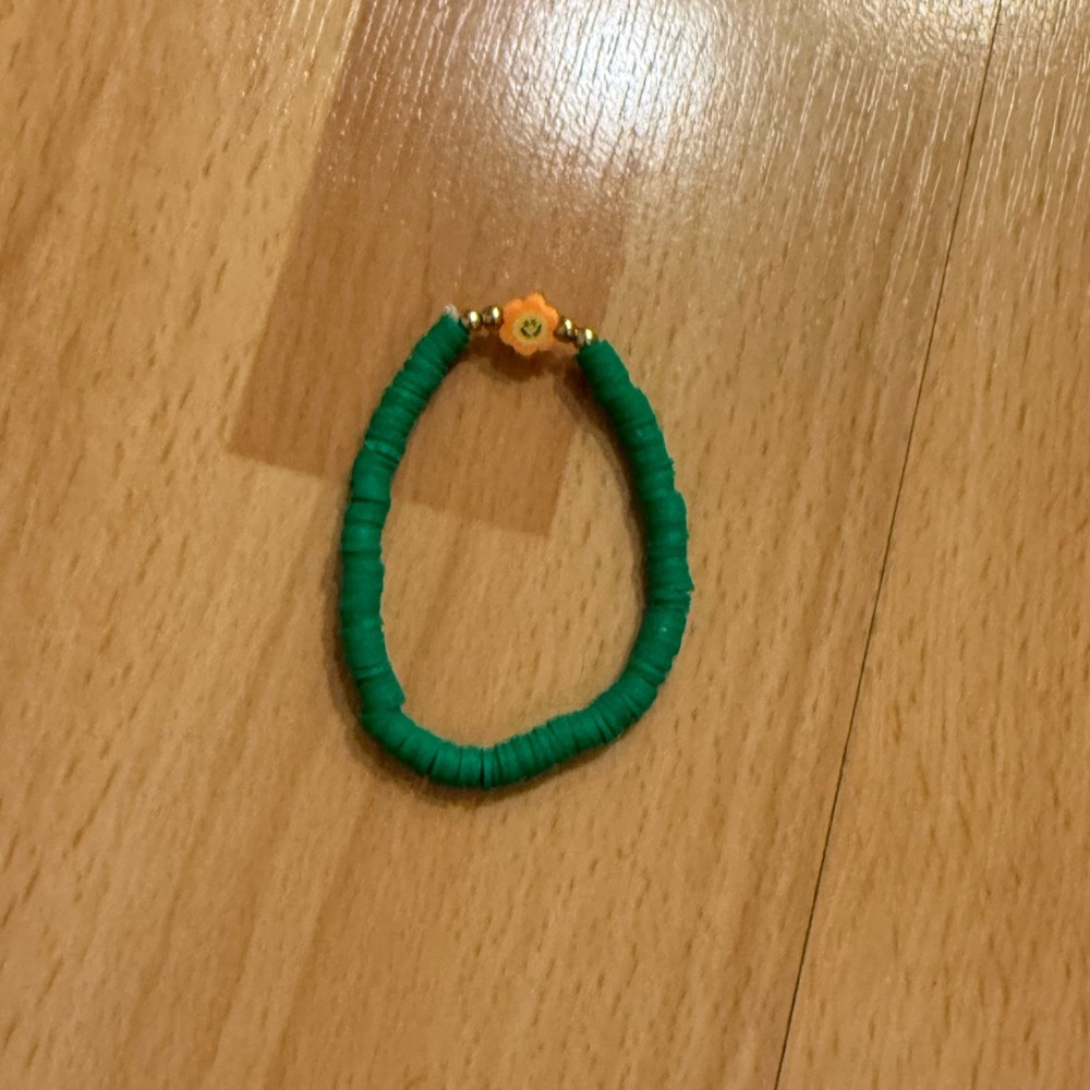 Green Beaded Bracelet with Orange Flower Charm